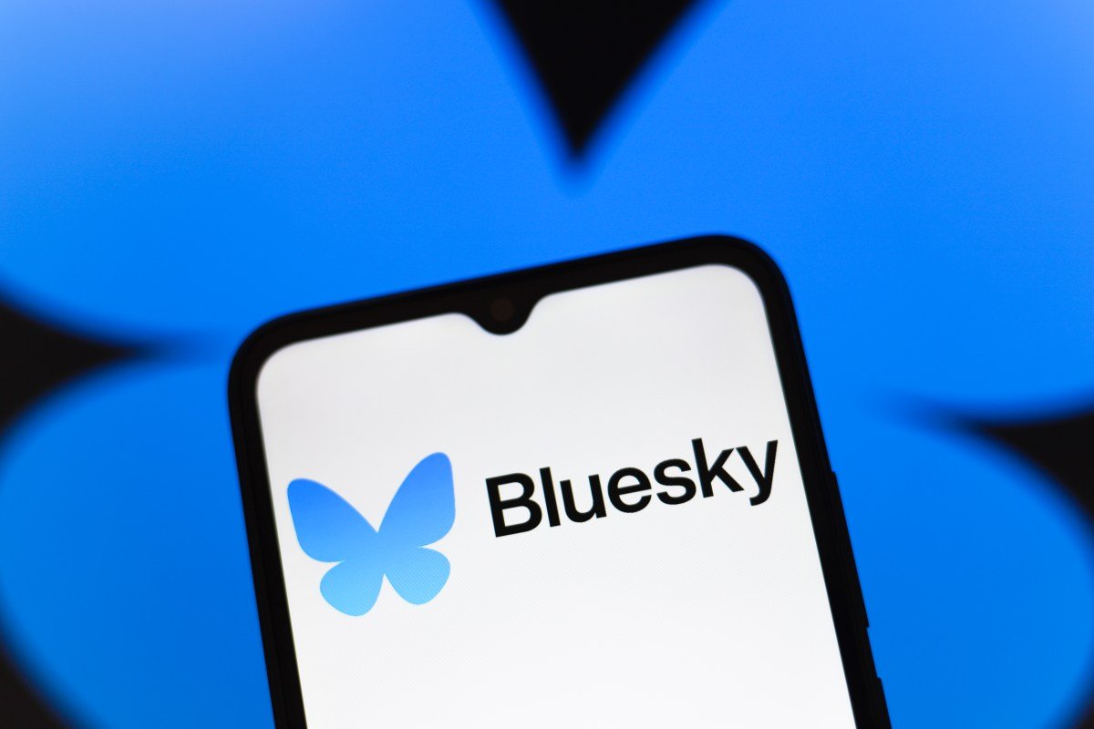 Bluesky logo appears on the screen of a smartphone