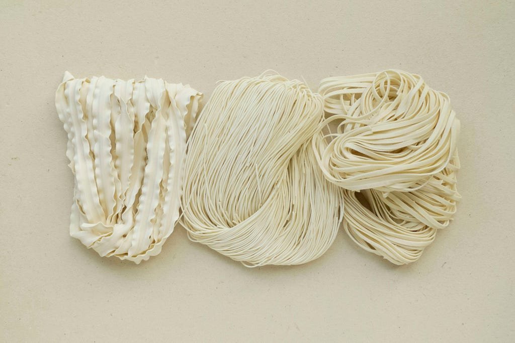 Three types of pasta, same background, same ingredients